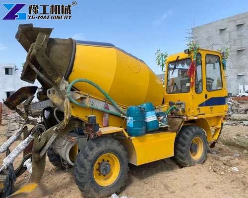 self loading concrete mixer truck on construction site