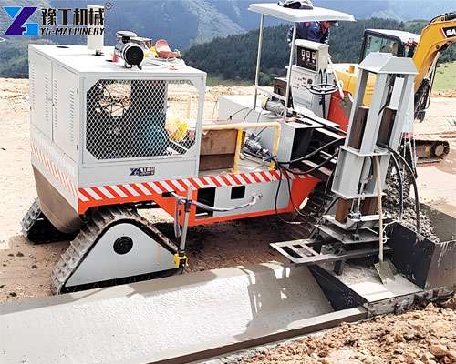 concrete curb machine working on road project