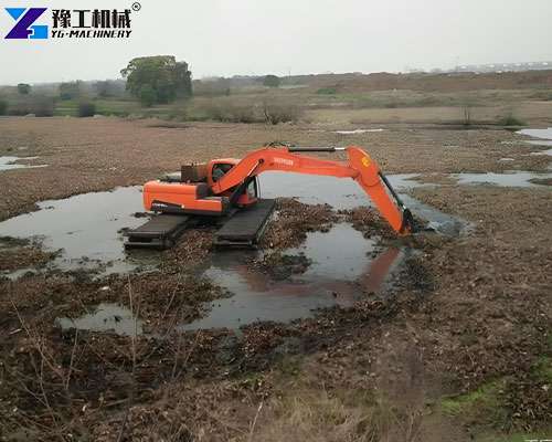 crawler excavator with wide tracks in swamp area