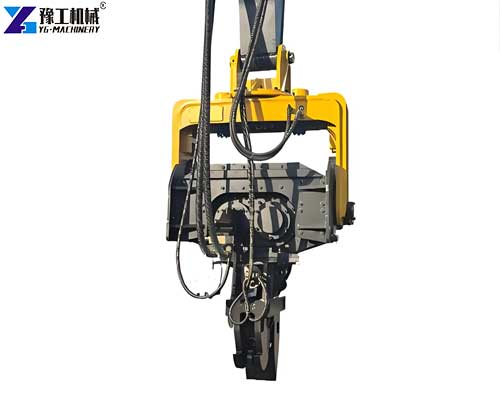 Excavator-mounted vibratory hammer installing H-piles