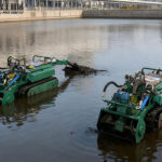 Lake dredging robot removing accumulated sediment from the lake bottom